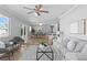 Open-concept living space with a dining area, living room, and ceiling fan at 529 59Th S Way, St Petersburg, FL 33707