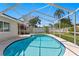 Backyard pool with a screened enclosure, blending indoor comfort with outdoor leisure at 529 59Th S Way, St Petersburg, FL 33707