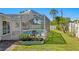An exterior of a screened-in pool with patio furniture, landscaping, and plants nearby at 529 59Th S Way, St Petersburg, FL 33707