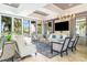 This elegant clubhouse living room is bathed in natural light and features modern decor and comfortable seating at 5519 Tripoli Dr, Palmetto, FL 34221