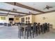 Community common room featuring beamed ceilings, fans, and dining and seating areas at 5519 Tripoli Dr, Palmetto, FL 34221