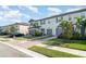 Townhomes boast meticulous landscaping, brick driveways, and attached garages at 5519 Tripoli Dr, Palmetto, FL 34221