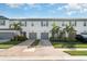 Inviting townhomes feature lush landscaping, brick driveways, and attached garages at 5519 Tripoli Dr, Palmetto, FL 34221