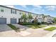 Well-manicured townhomes feature attached garages, paver driveways, and pristine landscaping at 5519 Tripoli Dr, Palmetto, FL 34221