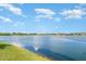 Community lake with lush green shoreline perfect for peaceful walks and enjoying nature at 5519 Tripoli Dr, Palmetto, FL 34221