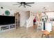 Open-concept living space with stairs, fan, and modern decor at 5519 Tripoli Dr, Palmetto, FL 34221