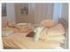 Comfortable bedroom features a bed with soft linens and pillows at 5541 Bay Blvd # 405, Port Richey, FL 34668