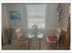 Cozy dining area featuring a table with two chairs, perfect for intimate meals at 5541 Bay Blvd # 405, Port Richey, FL 34668