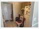 Small kitchen featuring tile floors, wood cabinets, and white appliances at 5541 Bay Blvd # 405, Port Richey, FL 34668