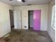 Bedroom with an interior view of purple doors and natural lighting at 5630 47Th N Ave, Kenneth City, FL 33709
