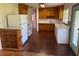 The kitchen features classic wood cabinets and plenty of counter space for culinary creations at 5630 47Th N Ave, Kenneth City, FL 33709