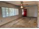 A bright living room features large windows, allowing ample natural light to illuminate the space at 5630 47Th N Ave, Kenneth City, FL 33709