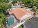 Aerial view showcases the home's pool, fenced backyard, and well-maintained landscaping at 603 Ivey Ln, Tarpon Springs, FL 34689