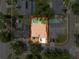 Aerial view of the property highlighting home location relative to nearby properties, roads, and surrounding landscape at 603 Ivey Ln, Tarpon Springs, FL 34689