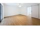 Bright, spacious bedroom featuring wood floors and a sliding barn door at 603 Ivey Ln, Tarpon Springs, FL 34689