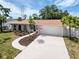 Beautiful single-story home with an attached two-car garage and well-maintained lawn at 603 Ivey Ln, Tarpon Springs, FL 34689