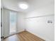 Bright laundry room features wood-look floors, a window, washer/dryer hookups, and a wire shelf at 603 Ivey Ln, Tarpon Springs, FL 34689