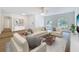 Bright and airy living room with stylish furnishings and ample natural light at 603 Ivey Ln, Tarpon Springs, FL 34689