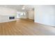 Cozy living room featuring a fireplace, open layout, and neutral decor at 603 Ivey Ln, Tarpon Springs, FL 34689