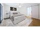 Serene main bedroom featuring modern decor, a ceiling fan, and a barn door to the bathroom at 603 Ivey Ln, Tarpon Springs, FL 34689