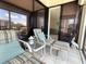 Relax on this beautiful balcony, furnished with comfortable seating and offering a glimpse of the serene interior at 6218 Palma Del Mar # 303, St Petersburg, FL 33715