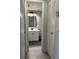 Bright bathroom featuring a single sink vanity and gray tile flooring at 6218 Palma Del Mar # 303, St Petersburg, FL 33715