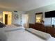 Comfortable bedroom featuring two queen beds, light-blue walls and a flat-screen TV for relaxing evenings at 6218 Palma Del Mar # 303, St Petersburg, FL 33715