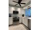 Bright and updated kitchen with stainless steel appliances and white cabinetry at 6218 Palma Del Mar # 303, St Petersburg, FL 33715