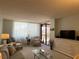 Comfortable seating area with a sliding glass door to the outside patio at 6218 Palma Del Mar # 303, St Petersburg, FL 33715