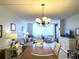 Cozy living room with dining area featuring neutral tones, and ample natural light at 6218 Palma Del Mar # 303, St Petersburg, FL 33715