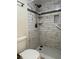 Elegant bathroom featuring a beautifully tiled shower with modern fixtures and a convenient built-in niche at 6218 Palma Del Mar # 303, St Petersburg, FL 33715