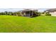 Expansive backyard with lush green lawn, perfect for outdoor activities at 644 Chipper Dr, Sun City Center, FL 33573