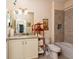 Well-lit bathroom featuring a granite-top vanity, tile floors, and a shower-tub combo at 644 Chipper Dr, Sun City Center, FL 33573