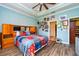 Primary bedroom with bed, pictures, and decoratively painted walls at 644 Chipper Dr, Sun City Center, FL 33573