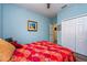 Comfortable bedroom offers ample closet space, wood look floors, and plenty of natural light at 644 Chipper Dr, Sun City Center, FL 33573