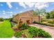 Charming home featuring a three-car garage and beautiful landscaping at 644 Chipper Dr, Sun City Center, FL 33573