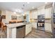 Kitchen with stainless steel dishwasher and oven and an island with granite countertop at 644 Chipper Dr, Sun City Center, FL 33573