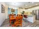 Kitchen with stainless steel appliances and breakfast bar with pendant lighting at 644 Chipper Dr, Sun City Center, FL 33573