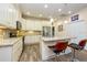 Kitchen with stainless steel appliances, breakfast bar, and wooden floors at 644 Chipper Dr, Sun City Center, FL 33573