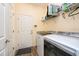 Convenient laundry room features modern washer and dryer units for efficient laundry care at 644 Chipper Dr, Sun City Center, FL 33573