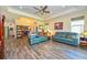 Open-concept living area featuring tile floors, neutral walls, recessed lighting, and comfortable seating at 644 Chipper Dr, Sun City Center, FL 33573