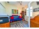 Functional office with a futon and a hardwood desk, ideal for work and relaxation at 644 Chipper Dr, Sun City Center, FL 33573