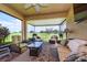 Relaxing screened patio features comfortable seating and scenic views of the lush golf course at 644 Chipper Dr, Sun City Center, FL 33573