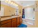 Bright bathroom features a vanity with granite countertops and a shower/tub combo at 6677 84Th N Ave, Pinellas Park, FL 33781