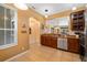 Bright kitchen features stainless steel appliances, tile flooring, and a breakfast bar, creating a modern and inviting space at 6677 84Th N Ave, Pinellas Park, FL 33781