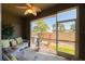 Inviting screened lanai with comfortable wicker furniture, ceiling fan, and view of the outdoors at 6677 84Th N Ave, Pinellas Park, FL 33781