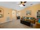 Comfortable living room with plush seating, a dark wood coffee table and natural light at 6677 84Th N Ave, Pinellas Park, FL 33781