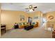 Bright and inviting living room with cozy seating and a decorative bookshelf at 6677 84Th N Ave, Pinellas Park, FL 33781