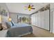 Serene main bedroom featuring a large window, plush bedding and ample closet space at 6677 84Th N Ave, Pinellas Park, FL 33781