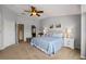 Cozy main bedroom with neutral tones, complemented by a walk-in closet and ensuite bathroom at 6677 84Th N Ave, Pinellas Park, FL 33781